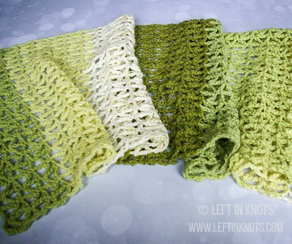 A green crochet triangle mesh wrap scarf