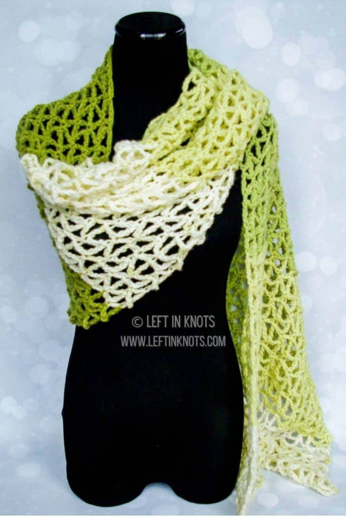 A green crochet triangle mesh wrap scarf