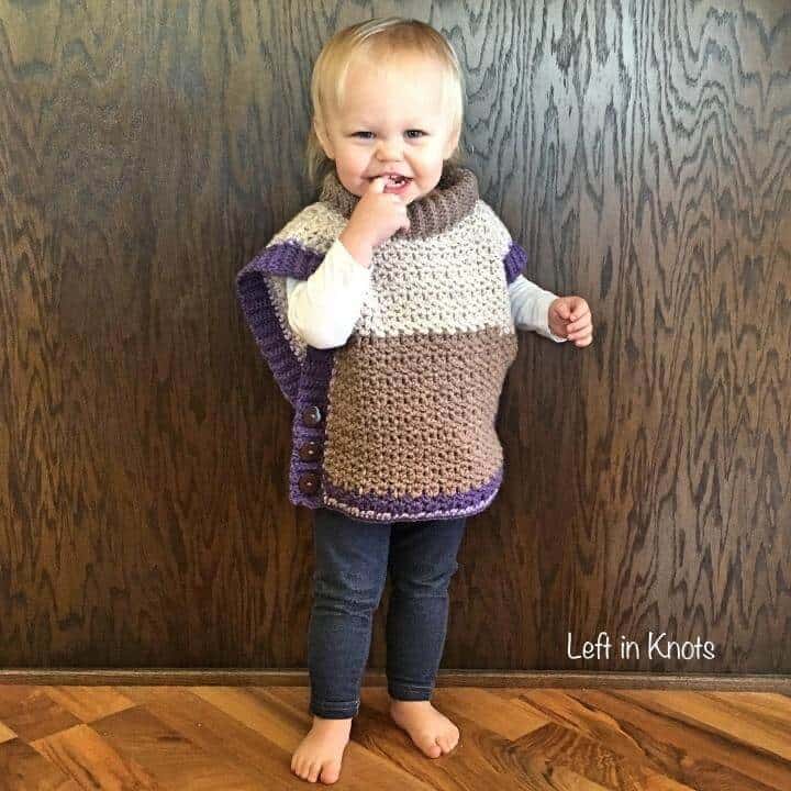 A crochet sweater poncho made with Caron Cakes yarn