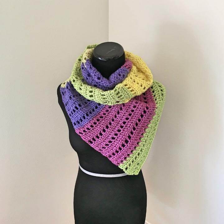 A fillet crochet scarf made with Caron Cakes