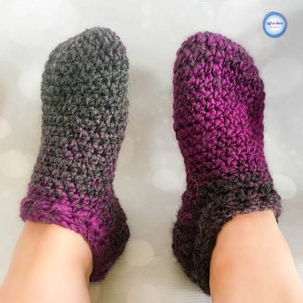 Purple and gray crochet slipper socks made with the star stitch