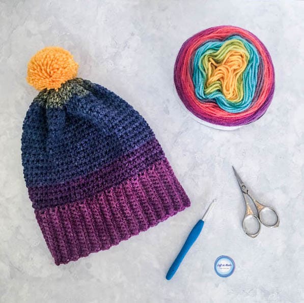 A rainbow crochet beanie made with Lion Brand Mandala yarn