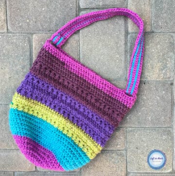 A color block crochet reusable market bag made with the star stitch