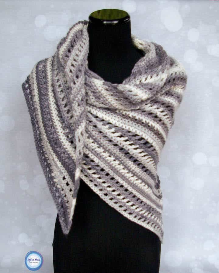 An easy crochet shawl made with gray and white yarn