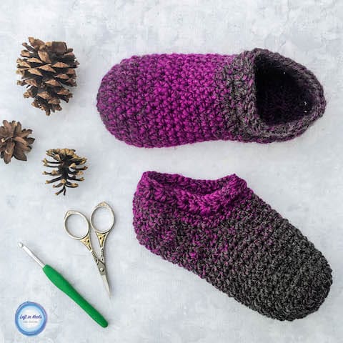 Purple and gray crochet slipper socks made with the star stitch