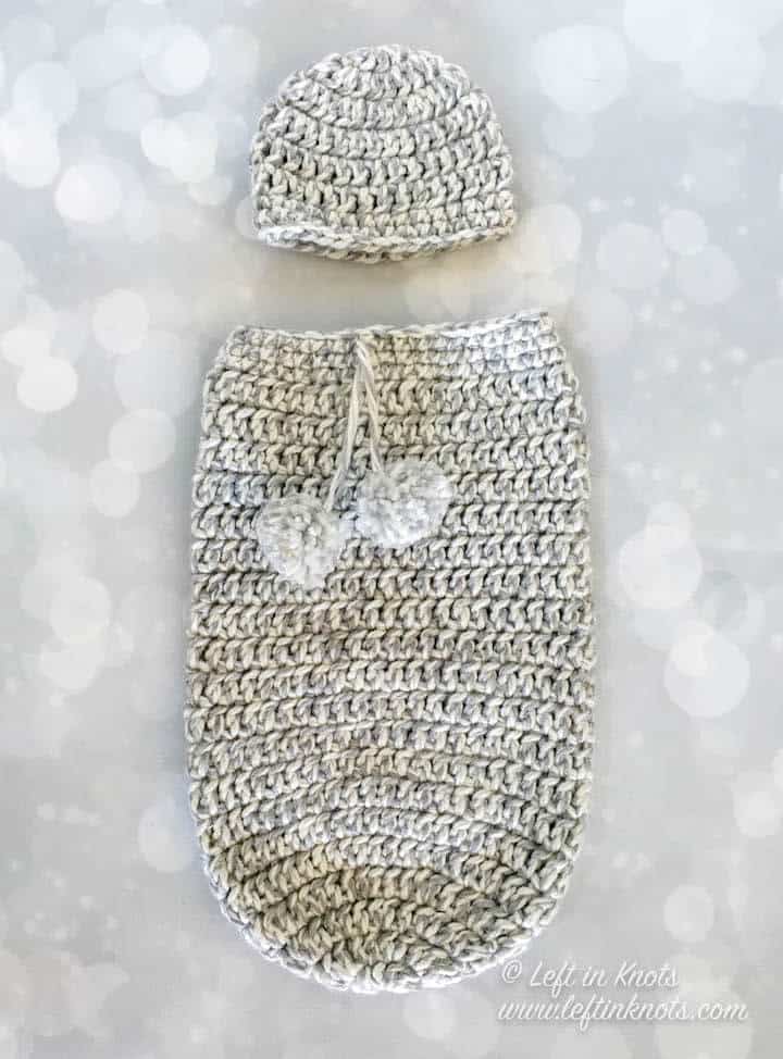 A gray gender neutral crochet newborn cocoon and hat set