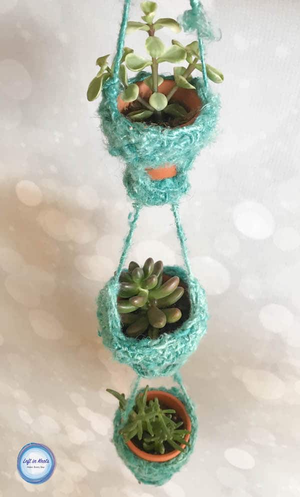 A crochet decorative succulent pot holder made with recycled yarn