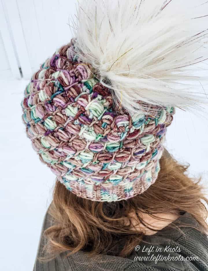 A crochet beanie made with hand dyed yarn and the bead stitch