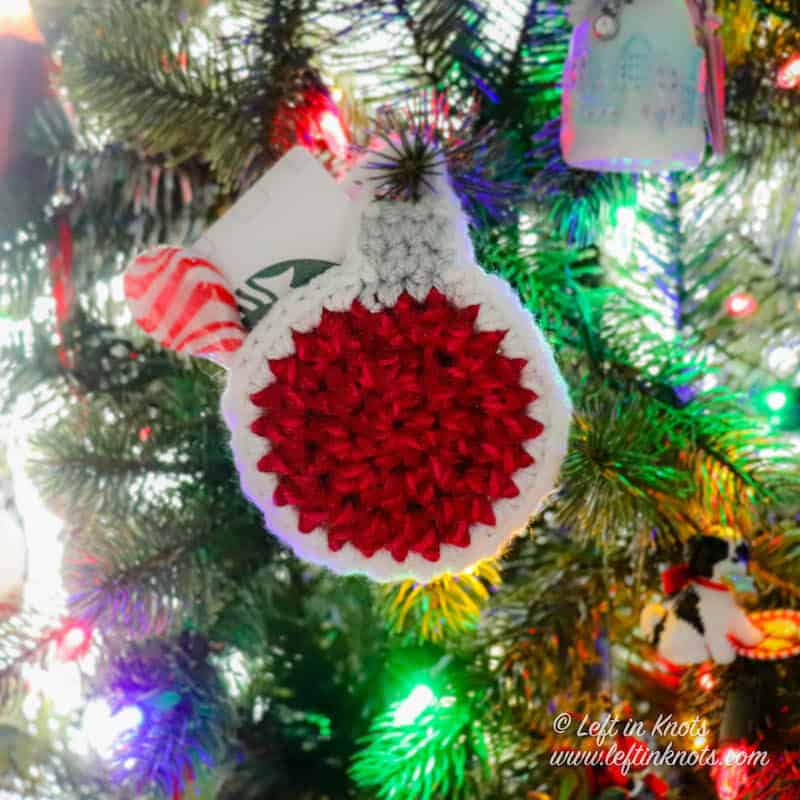 A crochet ornament gift card holder
