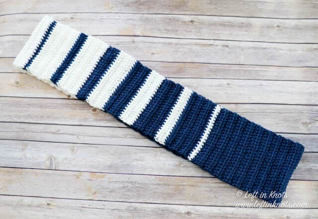 A two toned crochet infinity scarf with stripes
