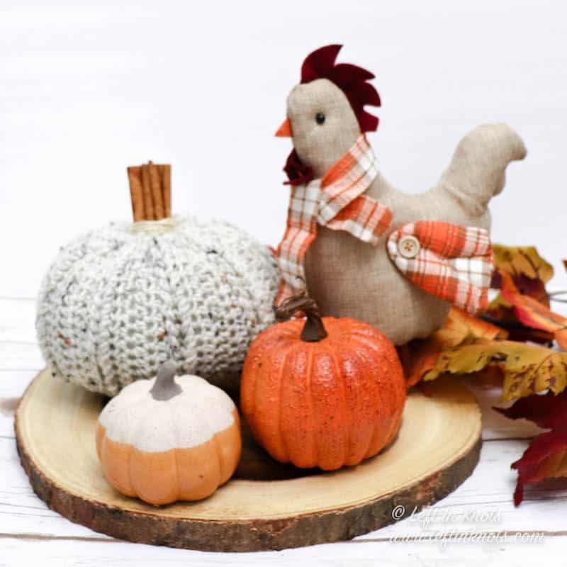 A crochet pumpkin with cinnamon stick stem