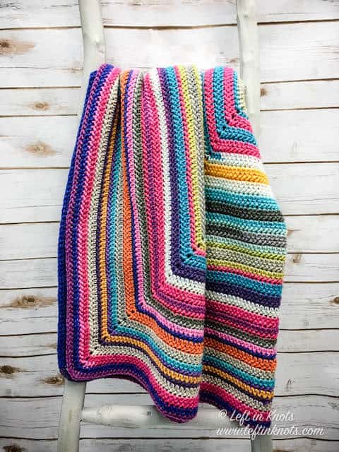 A crochet scrap afghan made with cake yarn