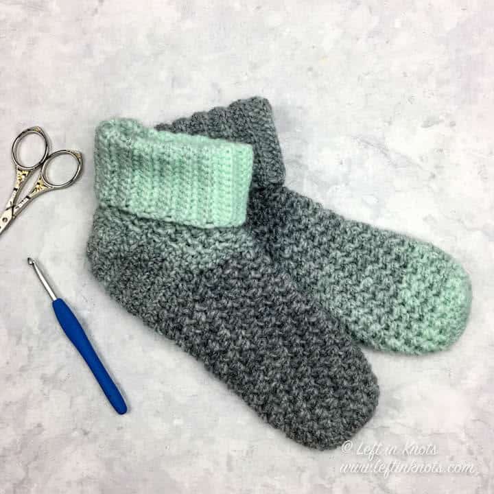 Mint and gray crochet slipper socks made with Lion Brand Scarfie yarn