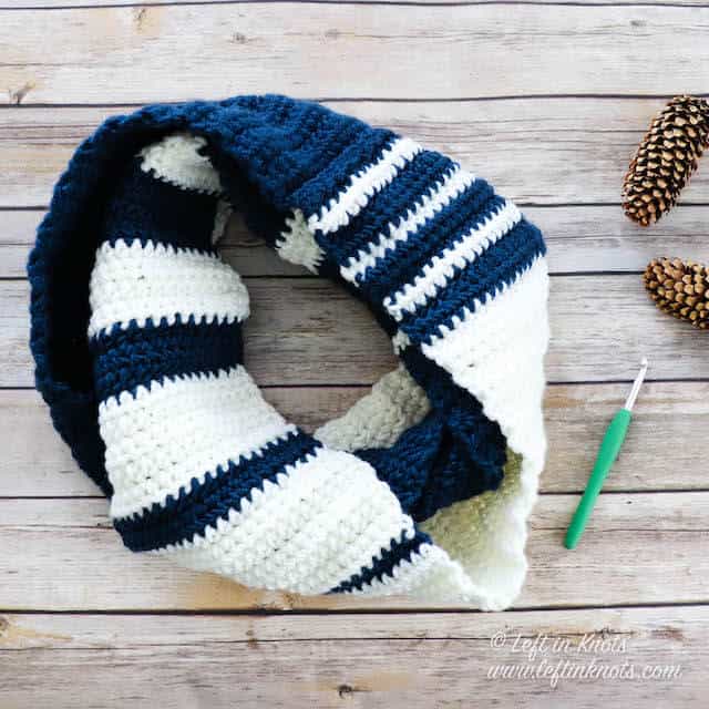 A two toned crochet infinity scarf with stripes