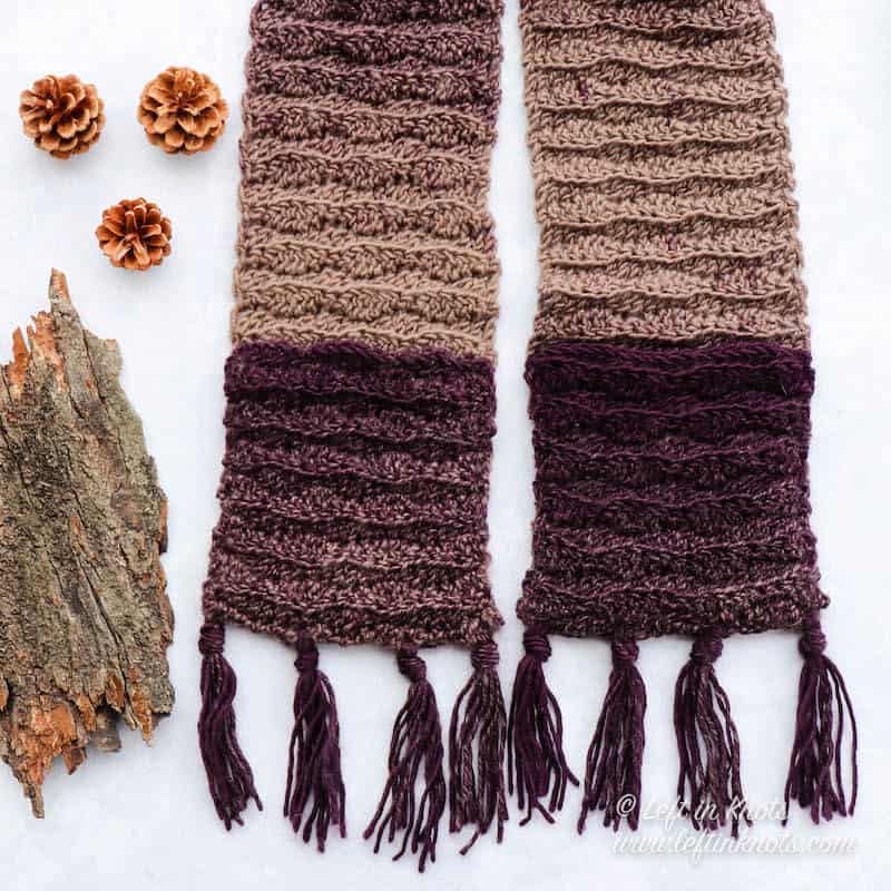 A narrow crochet pocket scarf with fringe