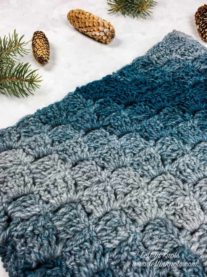 A blue and gray cowl made with one skein of yarn