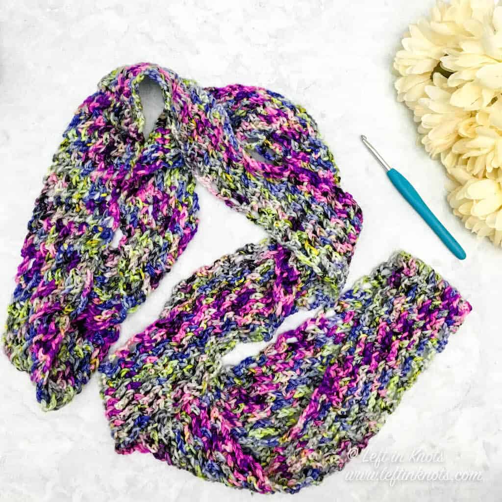 A narrow crochet infinity scarf made with hand dyed yarn