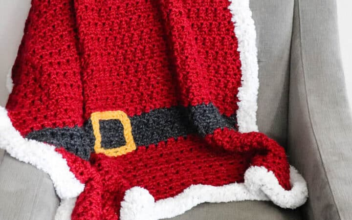 A red chunky Santa Christmas afghan with belt and fur border
