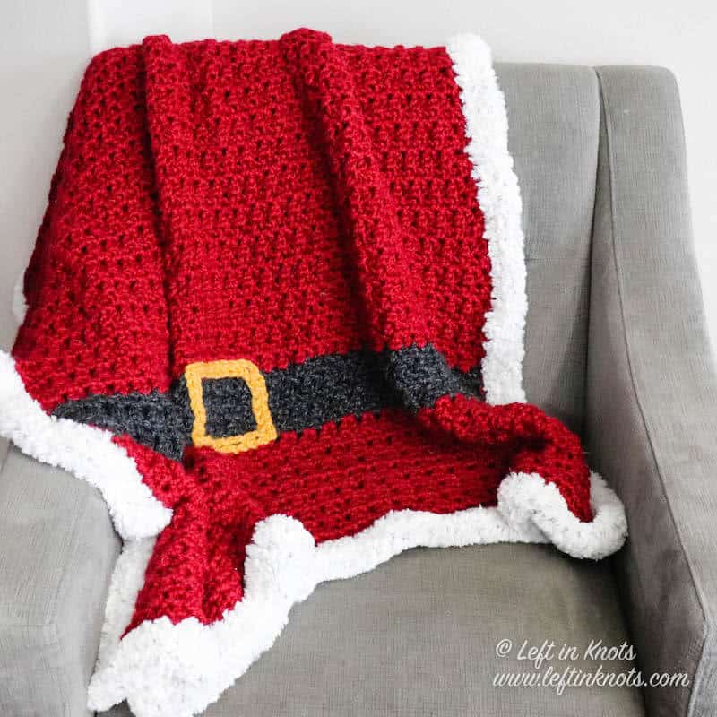 A red chunky Santa Christmas afghan with belt and fur border