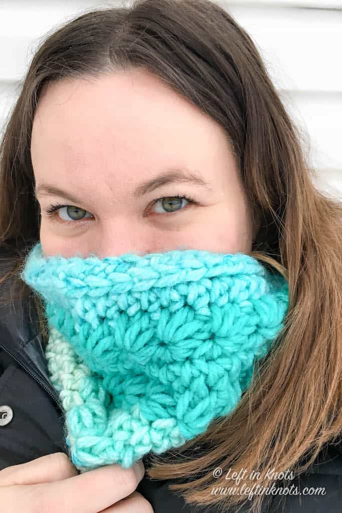 A turquoise crochet cowl made with the star stitch