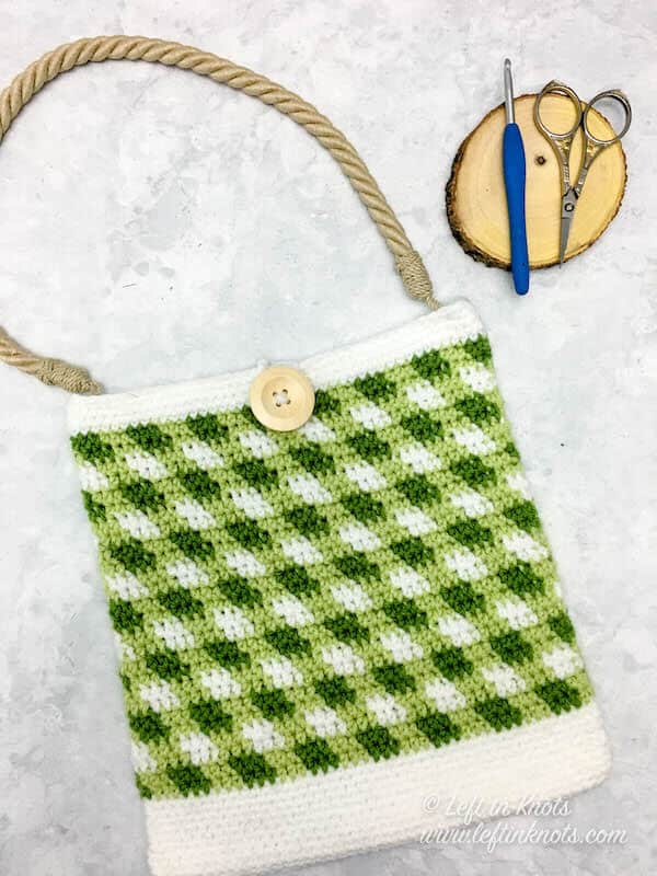 A green gingham plaid crochet market bag with rope handle