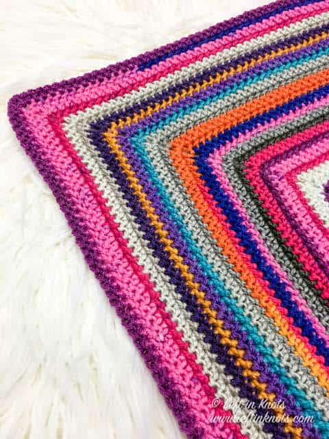 A crochet scrap afghan made with cake yarn