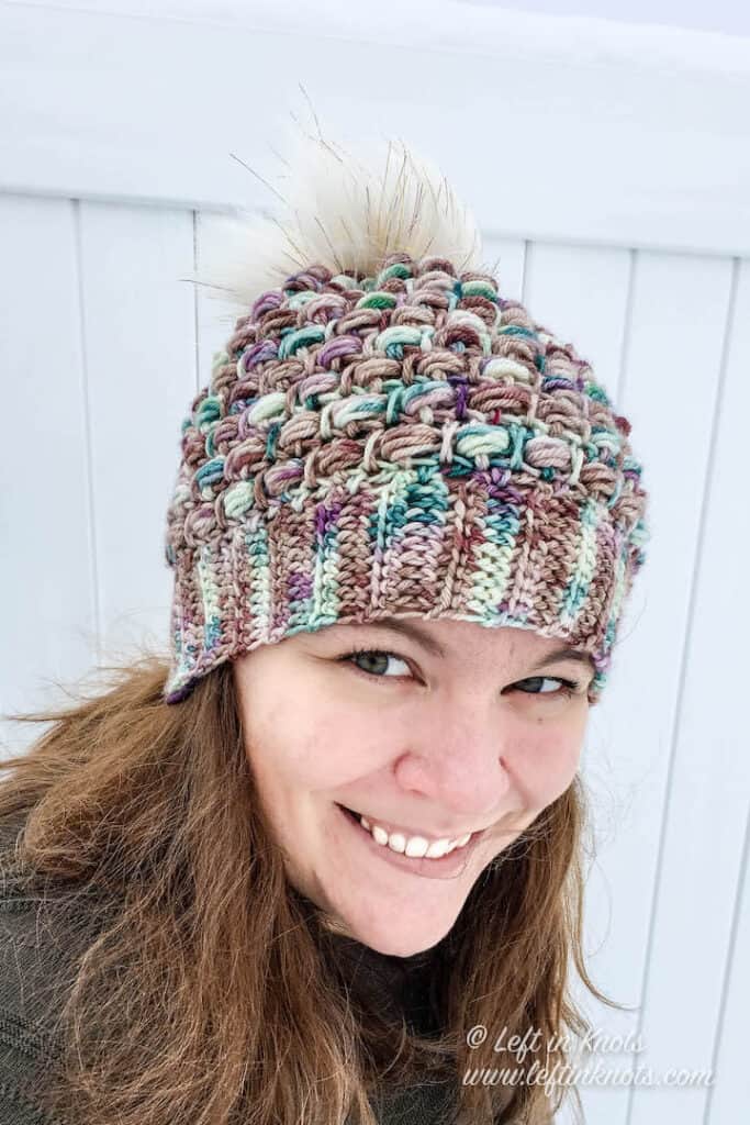 A crochet beanie made with hand dyed yarn and the bead stitch