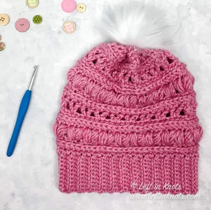 A crochet beanie made with the heart puff stitch