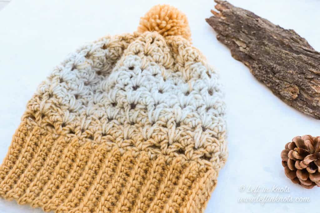 A gold and ice blue crochet beanie
