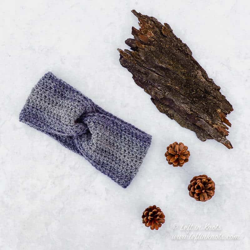 A gray and blue twisted ear warmer crochet pattern