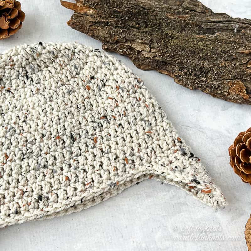 A crochet beanie with earflaps