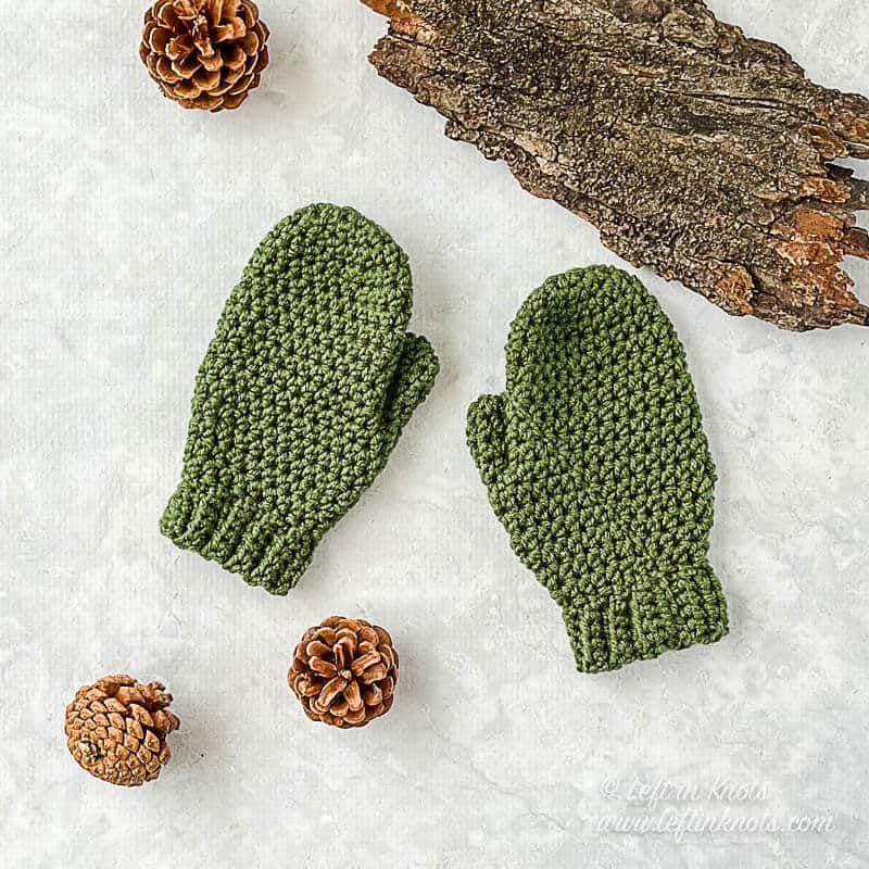 Green crochet children's mittens